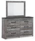 Bronyan King Panel Bed with Mirrored Dresser and Nightstand